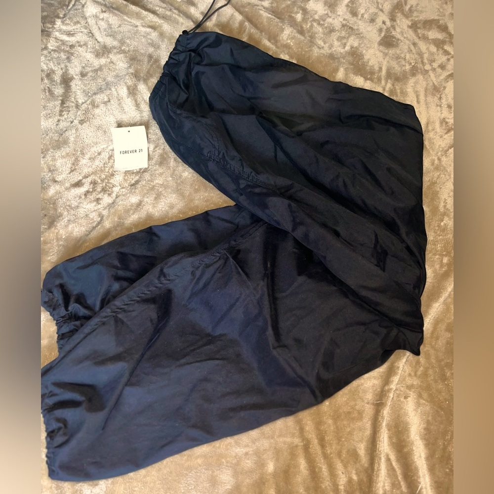 Never been worn parachute pants with tags on